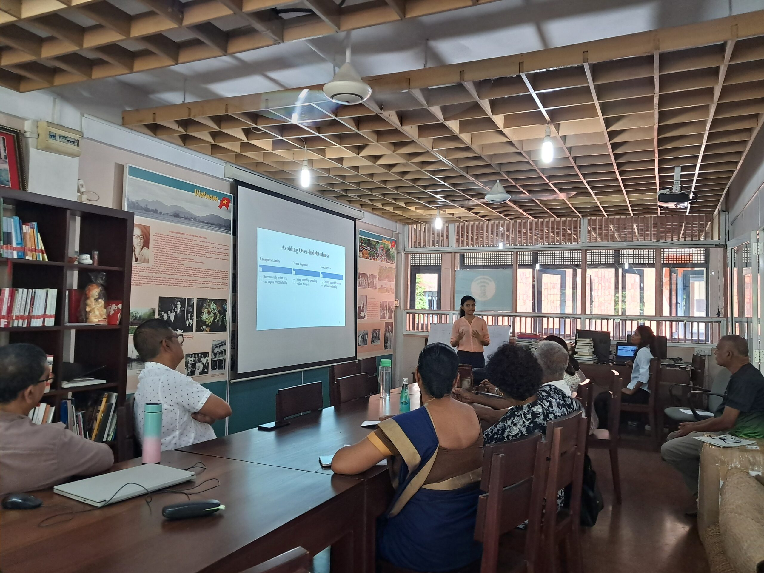 Teaching associate delivering a session with slides.